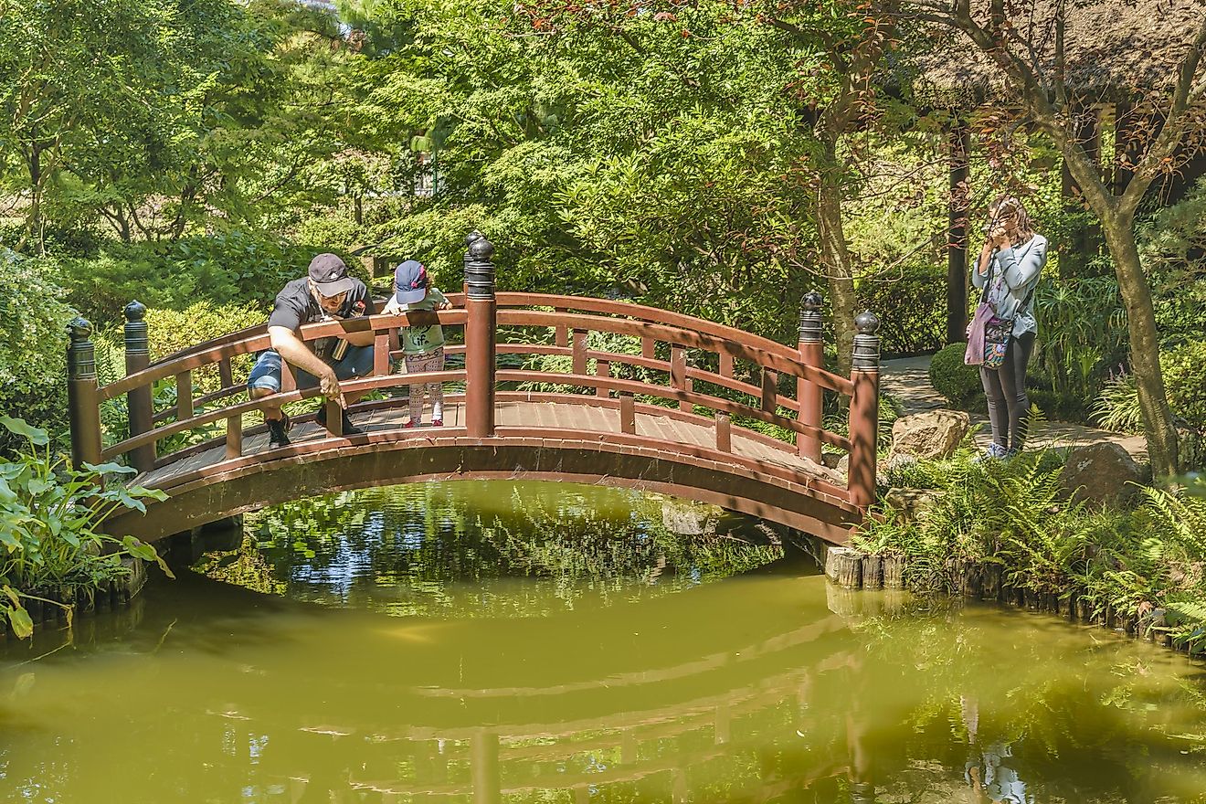 A family enjoying Montevideo Botanic Garden which is located behind Suarez Residence. Editorial credit: DFLC Prints / Shutterstock.com