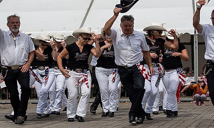 A group of performers tap-dancing.