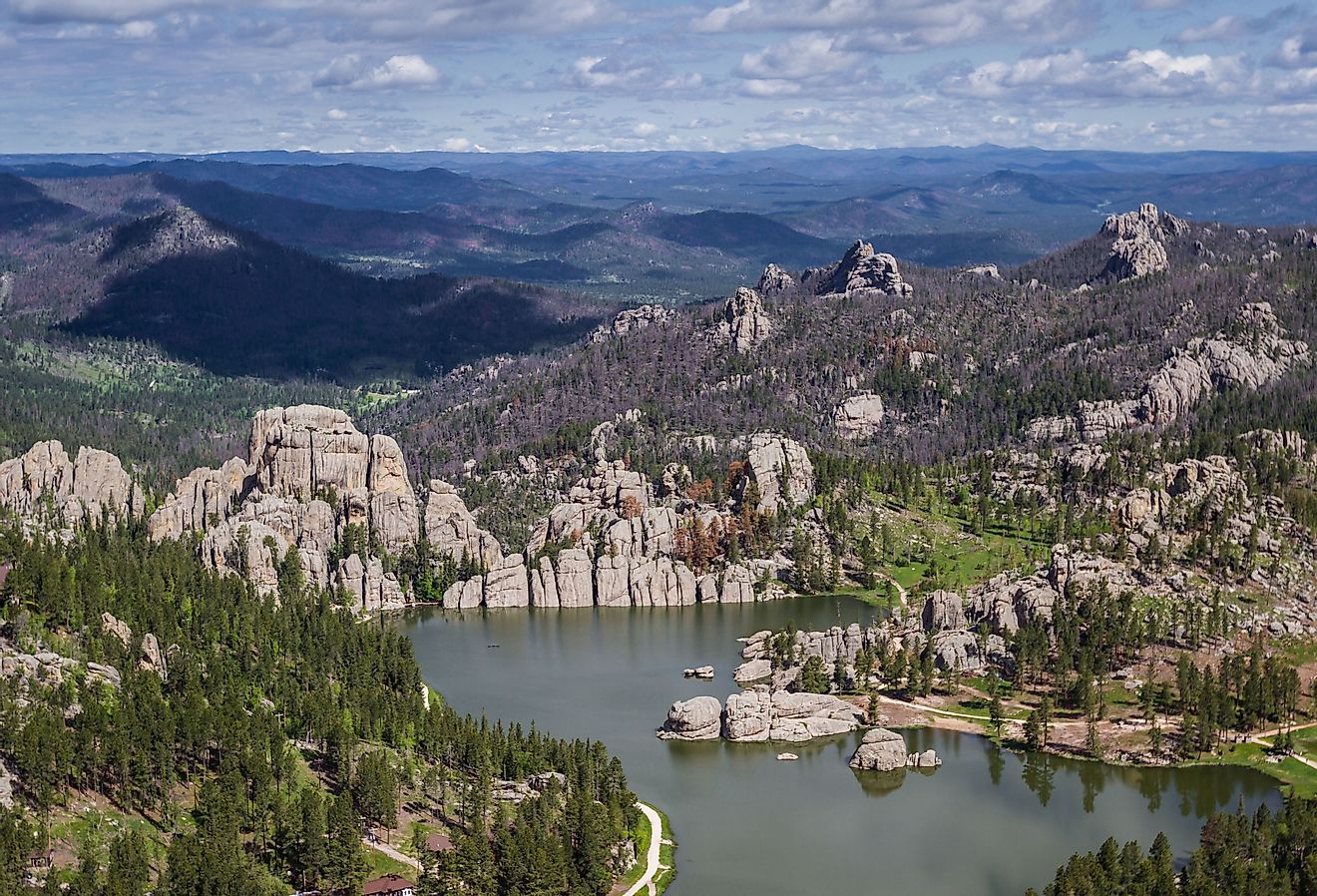 Aerial view of Sylvan Lake and granite formations in the Black Hills. Image credit Wollertz via Shutterstock.