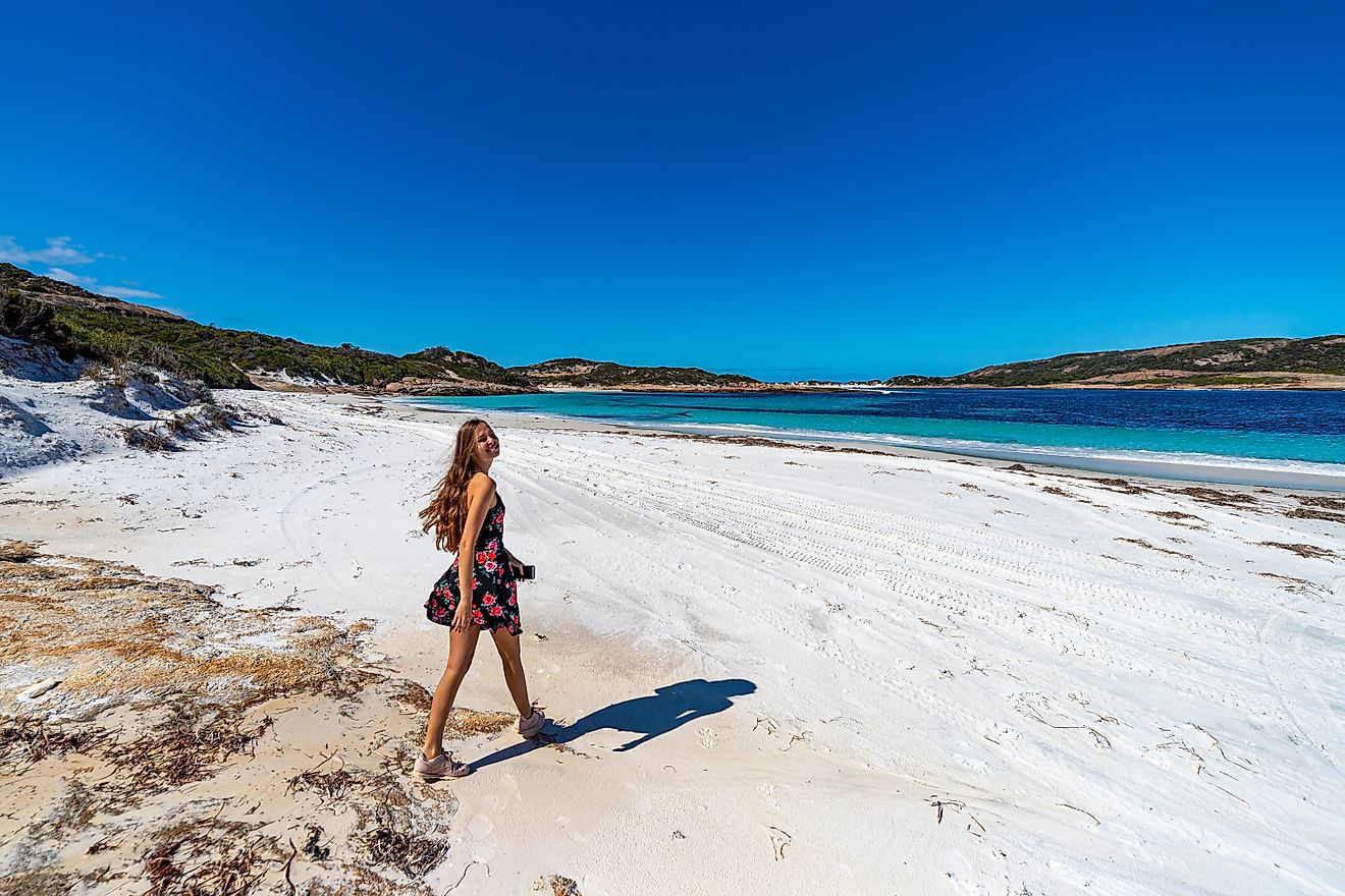 Woman walking on Cape Le Grand National Park near Esperance, Western Australia.
