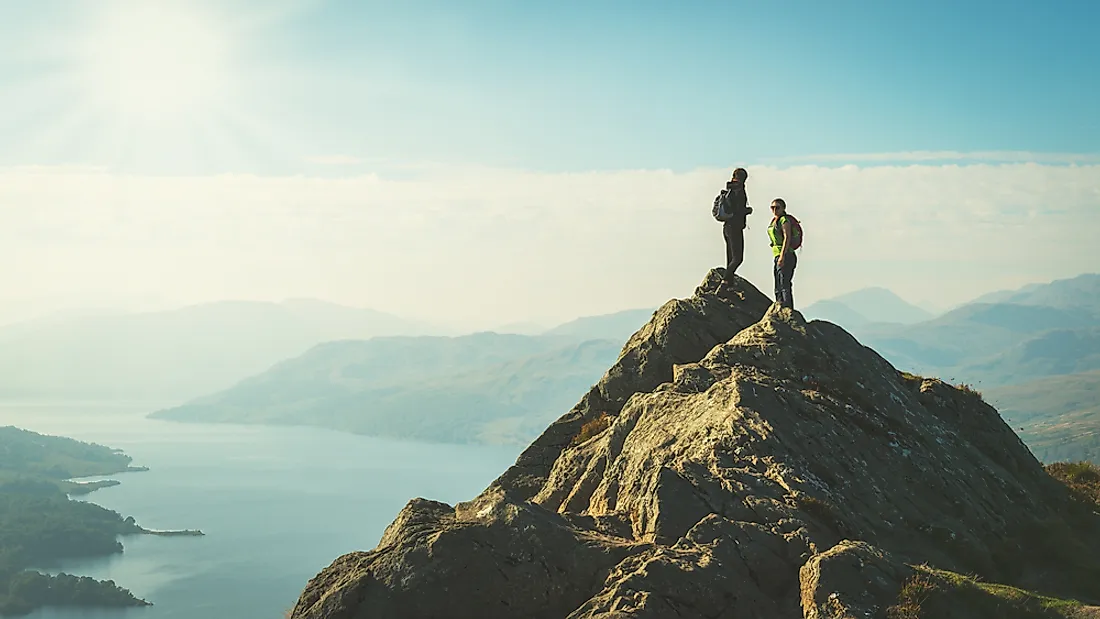 Tourists explore the Scottish highlands. 