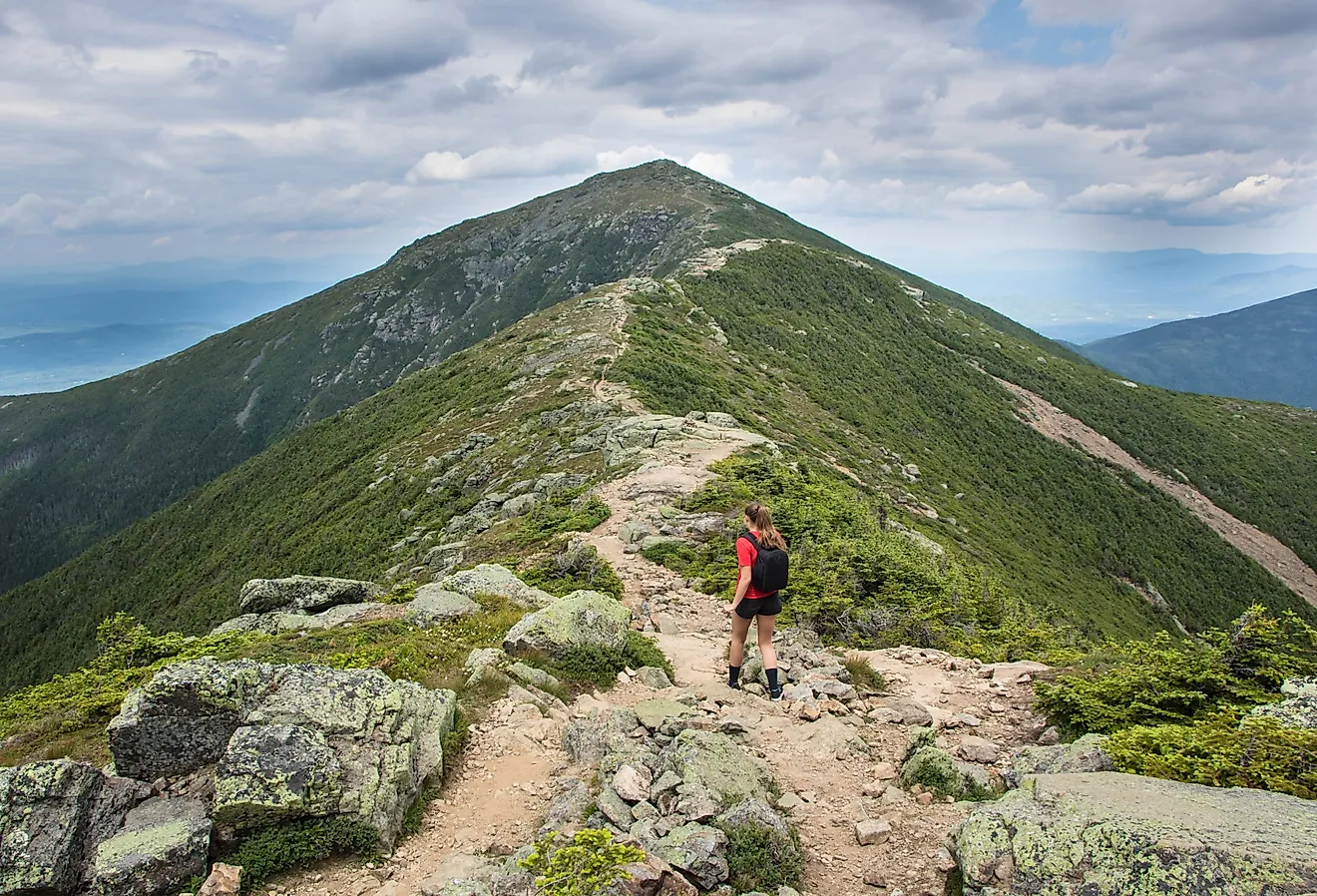 Young teenage girl walking on the Franconia Ridge Trail in New Hampshire’s White Mountains.