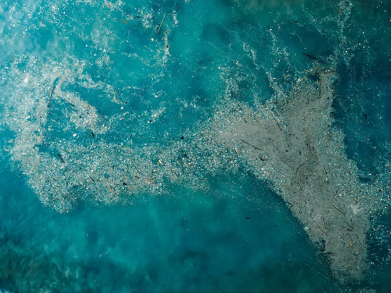 Ocean water and plastic trash island. Aerial view of pollution by plastic rubbish