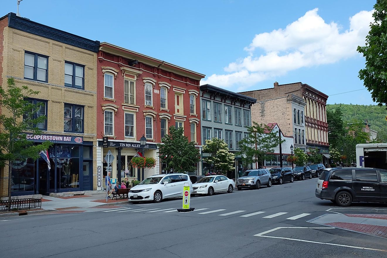 Main Street lined with colorful buildings in Cooperstown, New York. Editorial credit: Steve Cukrov / Shutterstock.com