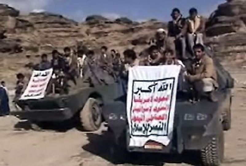 Houthi fighters rolling through the the Yemeni desert landscape.