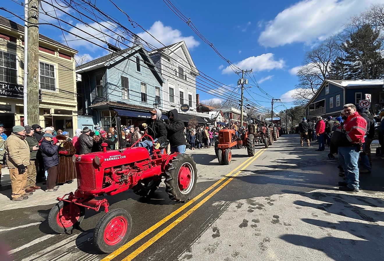 Tractors pass through the small New England town of Chester, Connecticut during a tractor parade. Image credit Joe Tabacca via Shutterstock