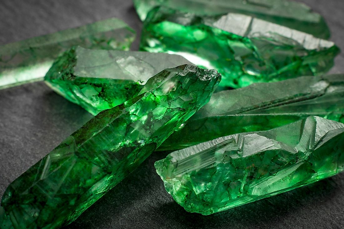 Green, uncut emeralds. 