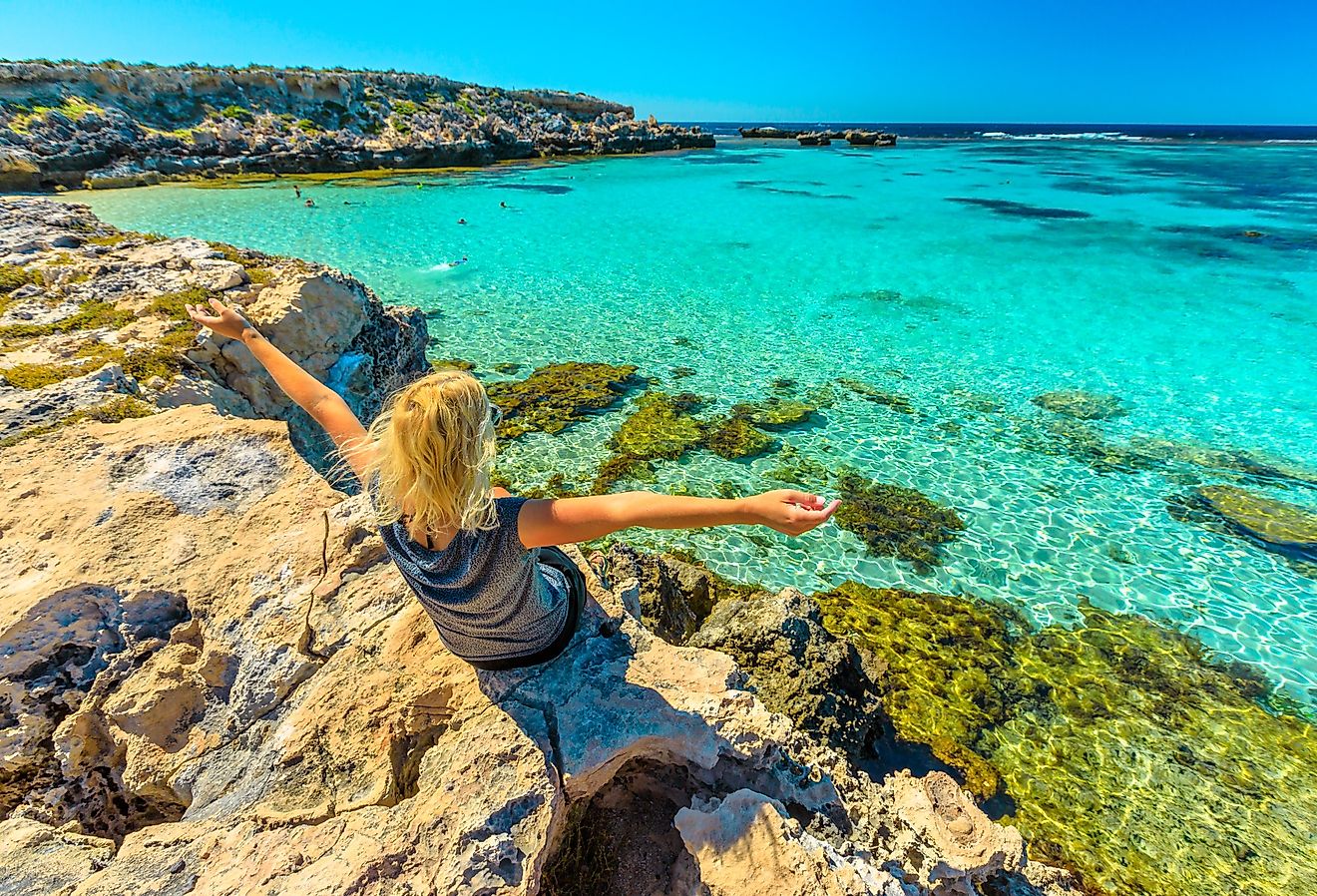 Tourist enjoying the spectacular view of the ocean on Rottnest Island, Western Australia.