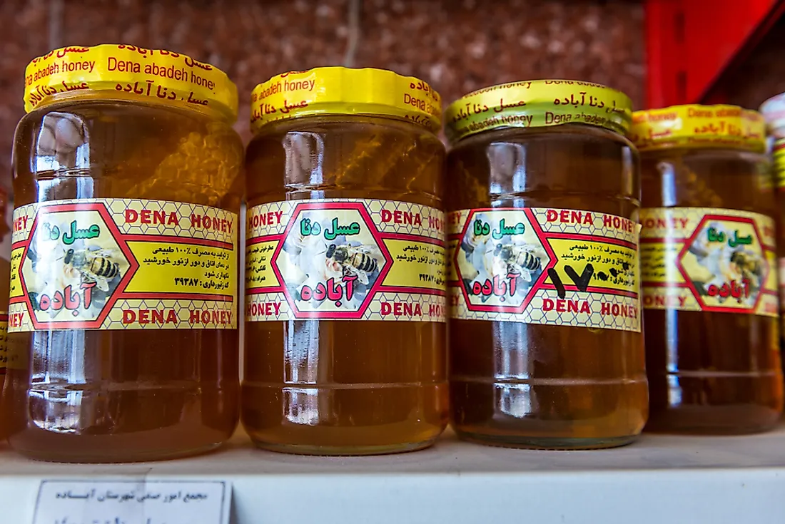 Honey on the shelf of a grocery store in Iran. Honey is consumed all over the world. Editorial credit: Fotokon / Shutterstock.com.