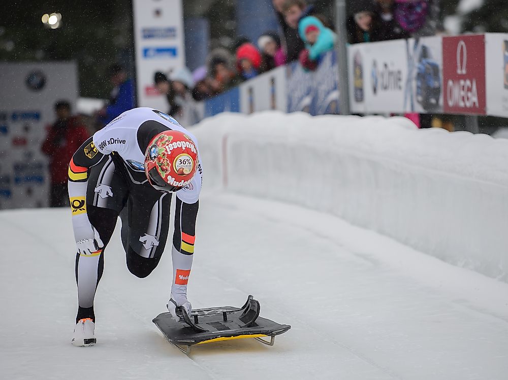 An athlete demonstrating the sport of skeleton. Photo credit: Daniel Hurlimann / Shutterstock.com.