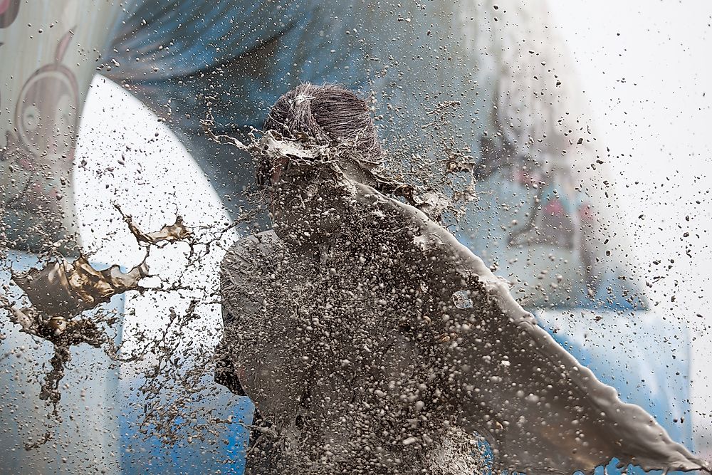 Festival goers are covered in mud at the Boryeong Mud Festival in Boryeong, South Korea. 