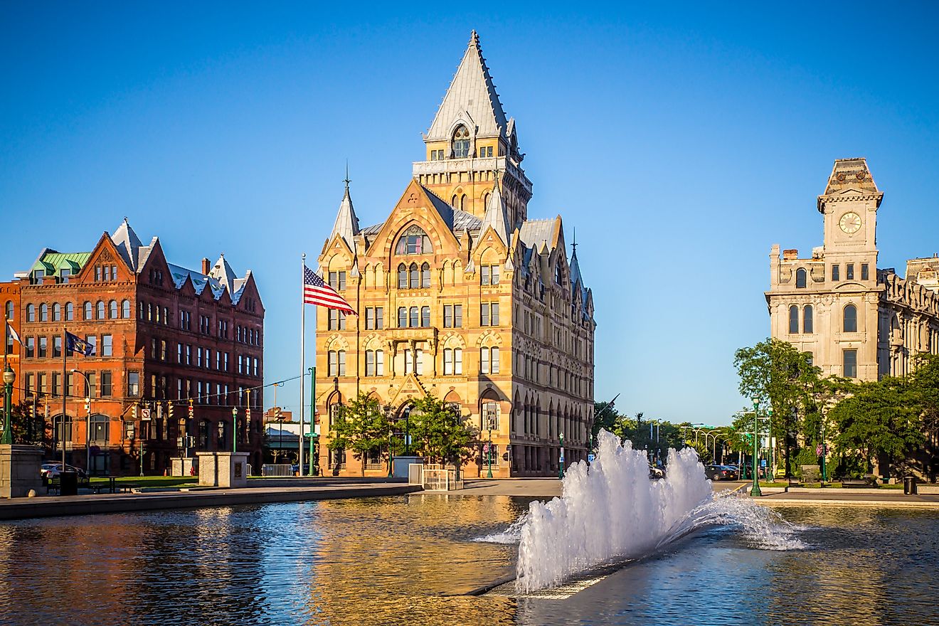 Downtown Syracuse New York with view of historic buildings and fountain at Clinton Square.