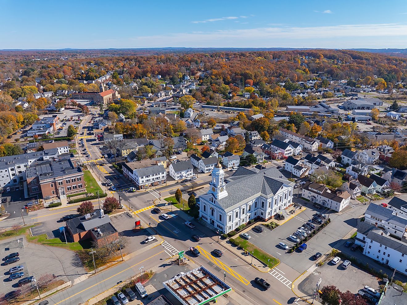 Milford Town Hall aerial view in fall at 52 Main Street in historic town center of Milford, Massachusetts.