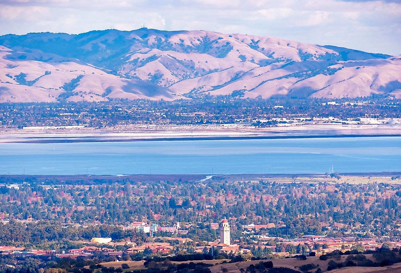 Aerial view of Palo Alto, San Francisco Bay Area; Newark and Fremont and the Diablo mountain range visible on the other side of the bay; Silicon Valley, California.