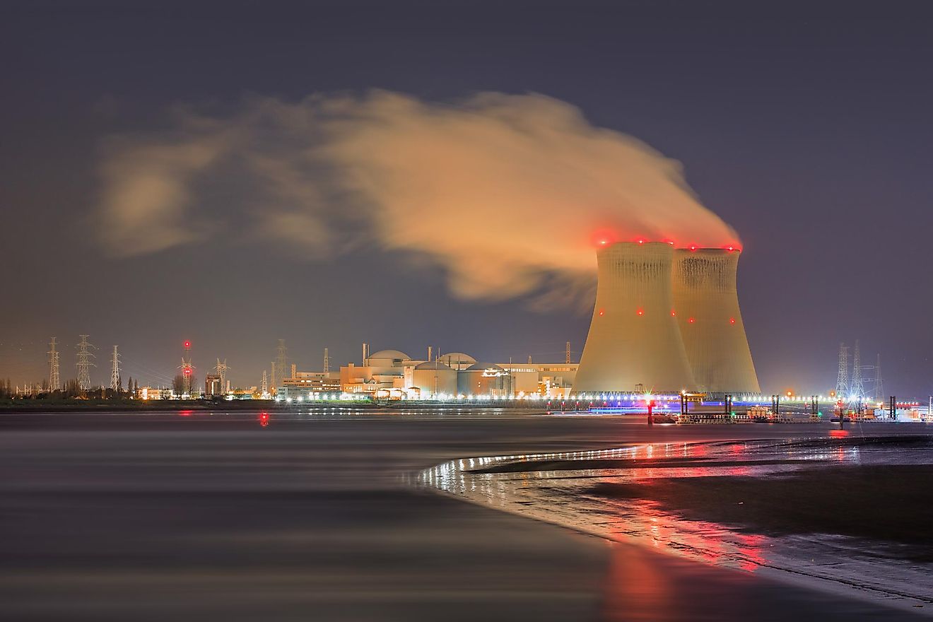 Night scene with view on riverbank with nuclear reactor Doel, Port of Antwerp, Belgium.