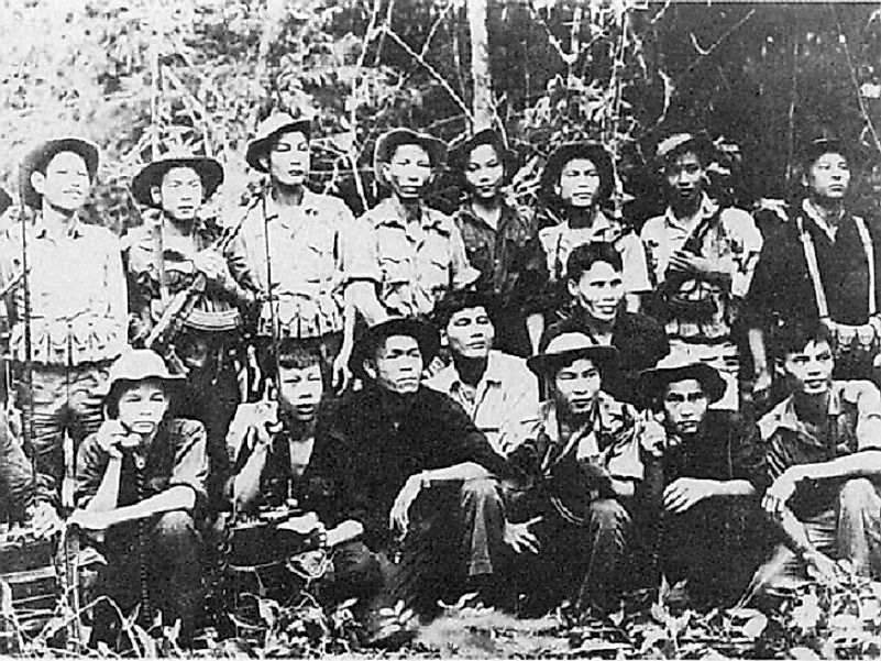 Viet Cong guerrillas involved in the Tet Offensive showing off their new armaments, including the iconic AK-47 assault rifles.
