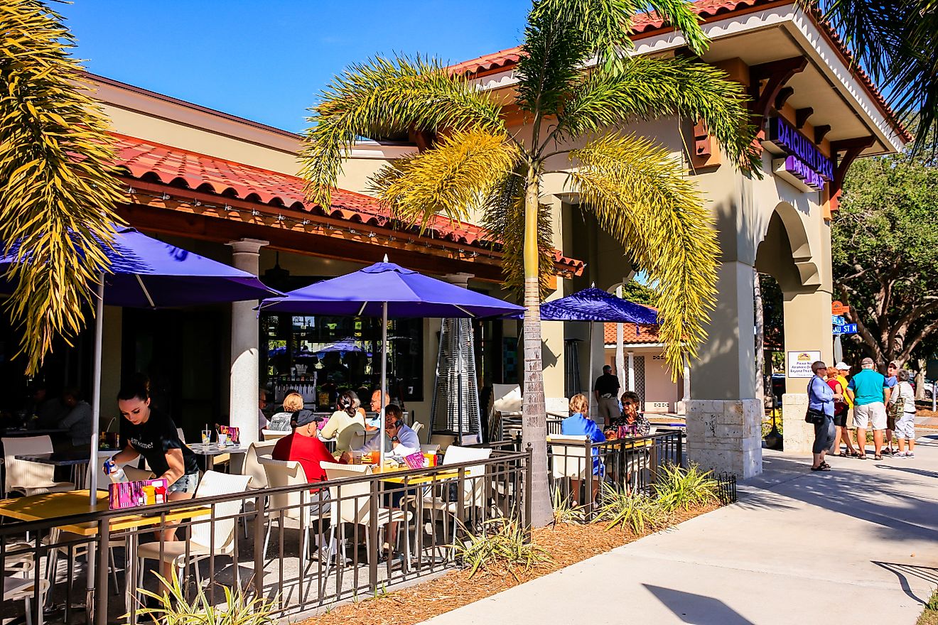 People enjoying an alfresco meal outside a restaurant in downtown Venice, Florida