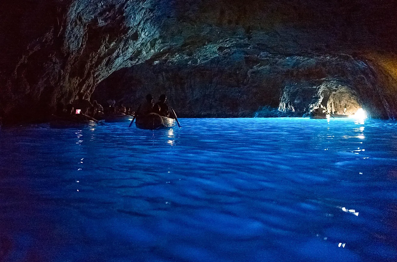 Boats with tourists in the Blue Grotto, Capri, Italy. Image credit: Gimas/Shutterstock.com