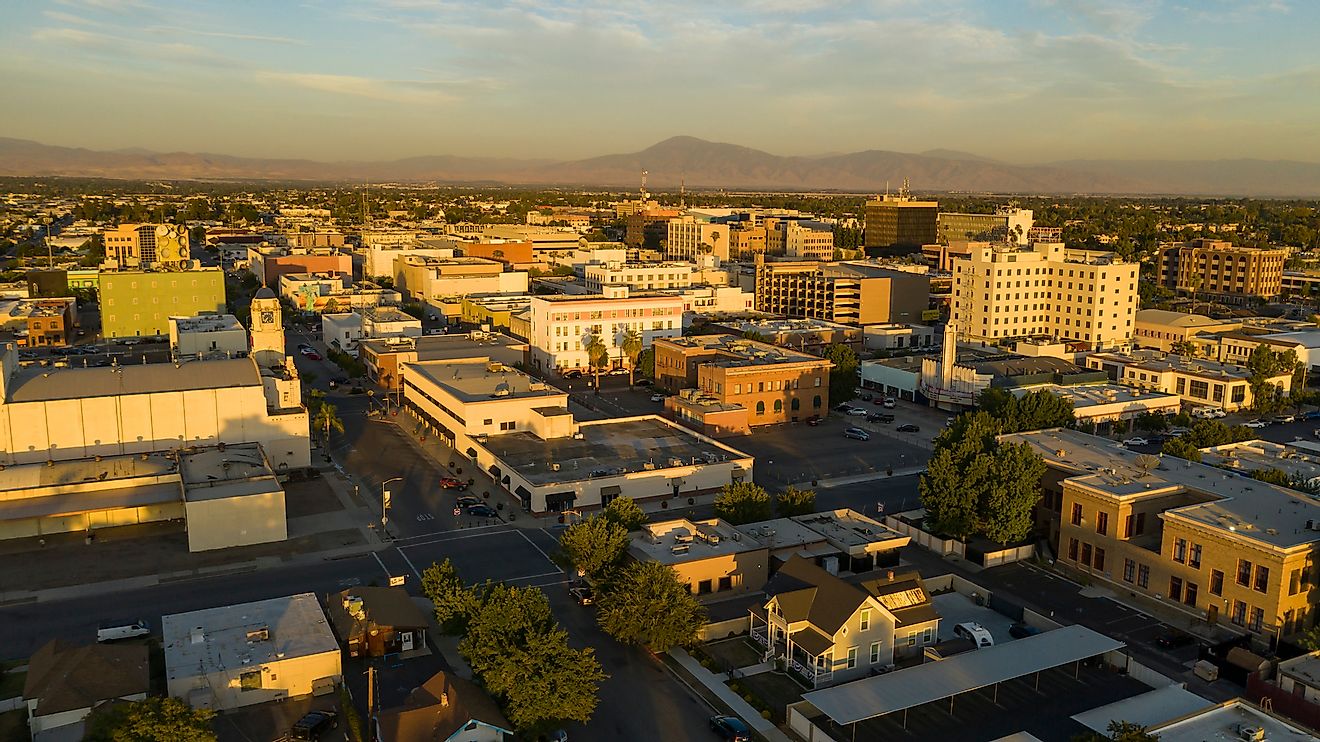 Aerial view of the southern city center downtown area of Bakersfield illuminated by late afternoon light.