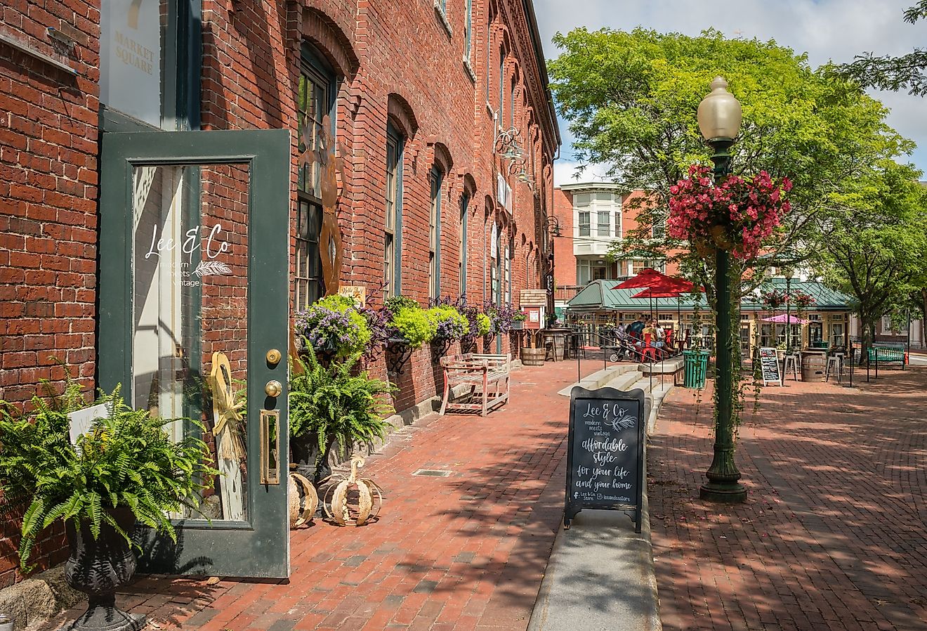 Downtown with historic brick mill buildings and trendy restaurants and charming shops in Amesbury, Massachusetts. Image credit Heidi Besen via Shutterstock