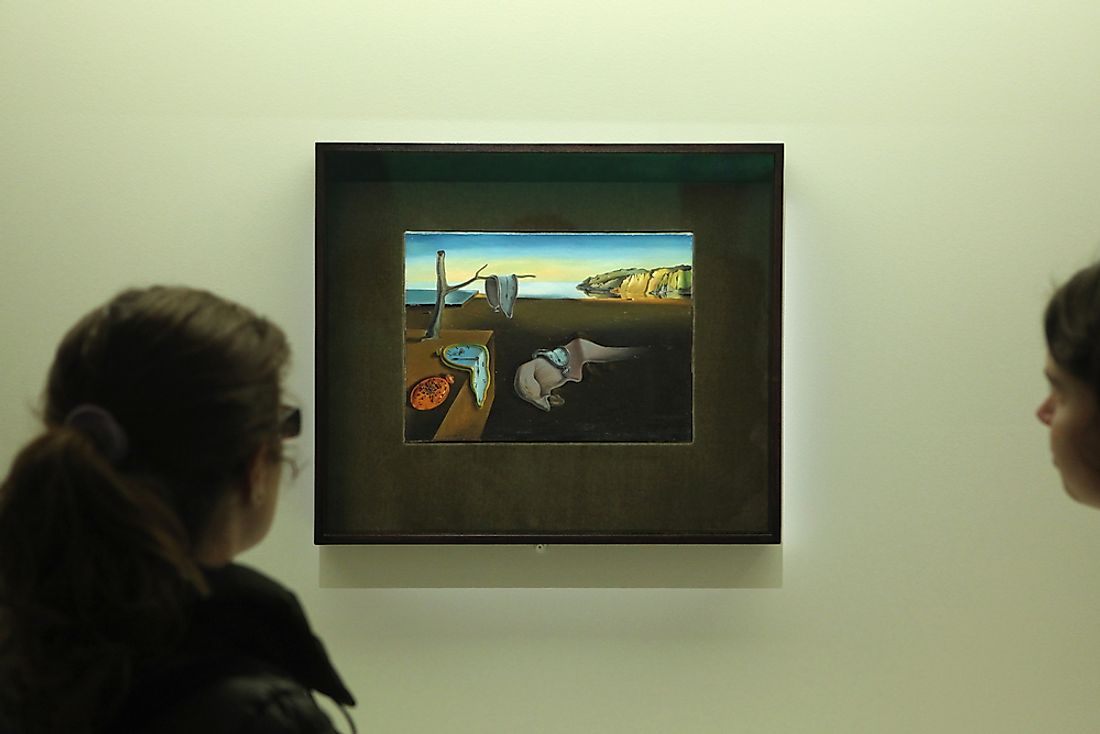 Editorial credit: Vladimir Wrangel / Shutterstock.com. Visitors onlook the painting "The Persistence of Memory". 