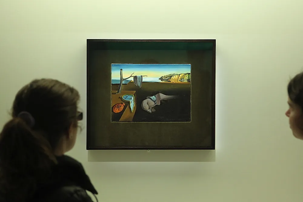 Editorial credit: Vladimir Wrangel / Shutterstock.com. Visitors onlook the painting "The Persistence of Memory".