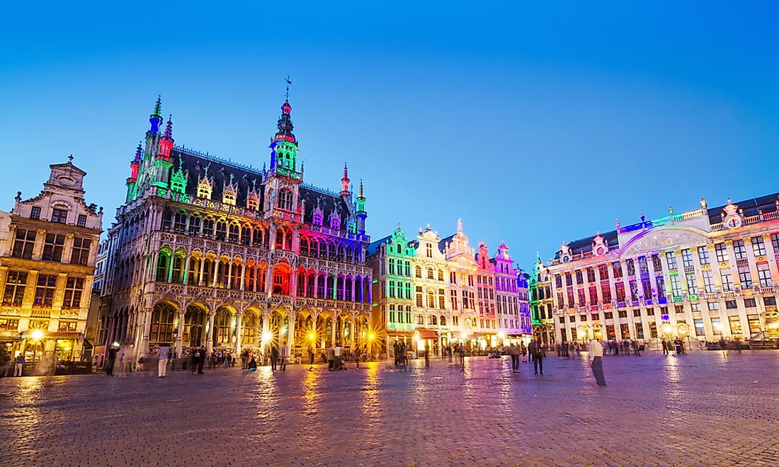 The Grand Palace in Brussels lit up with multi-colored lights.