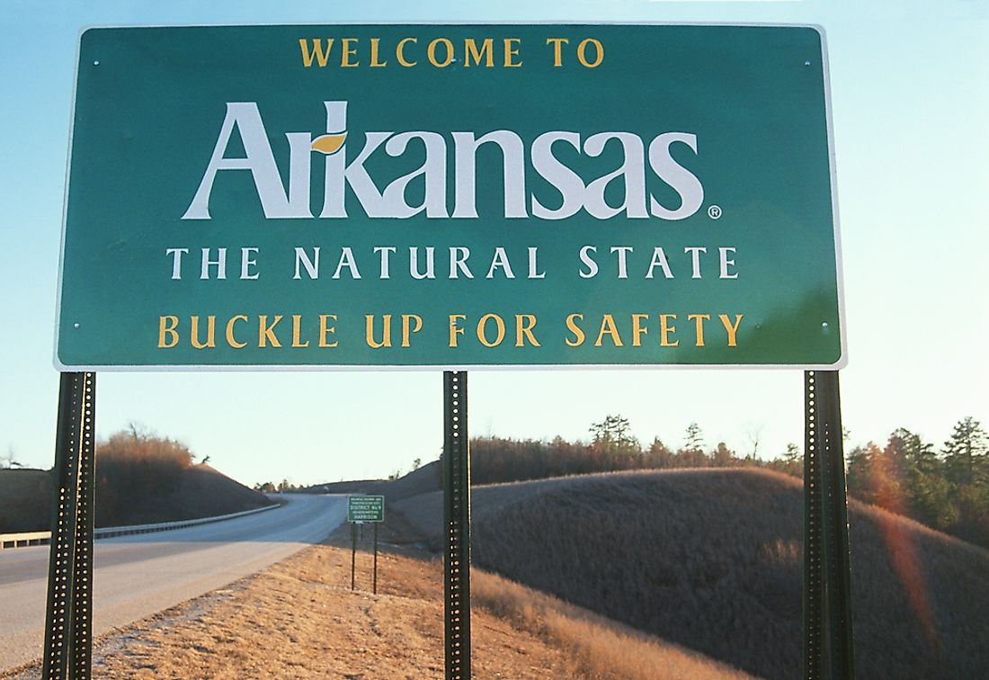 A "Welcome to Arkansas" sign. 