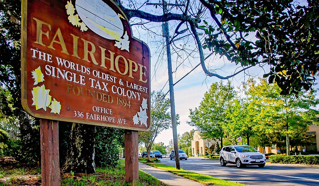 A sign welcomes visitors to Fairhope, Alabama, the worlds oldest and largest single tax colony. Image credit: Carmen K. Sisson / Shutterstock.com.