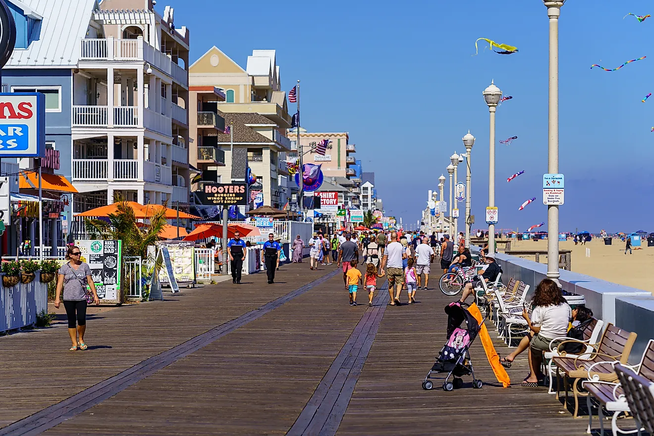 People walk on the Ocean City Boardwalk in Ocean City, Maryland. Image credit: George Sheldon / Shutterstock.com.