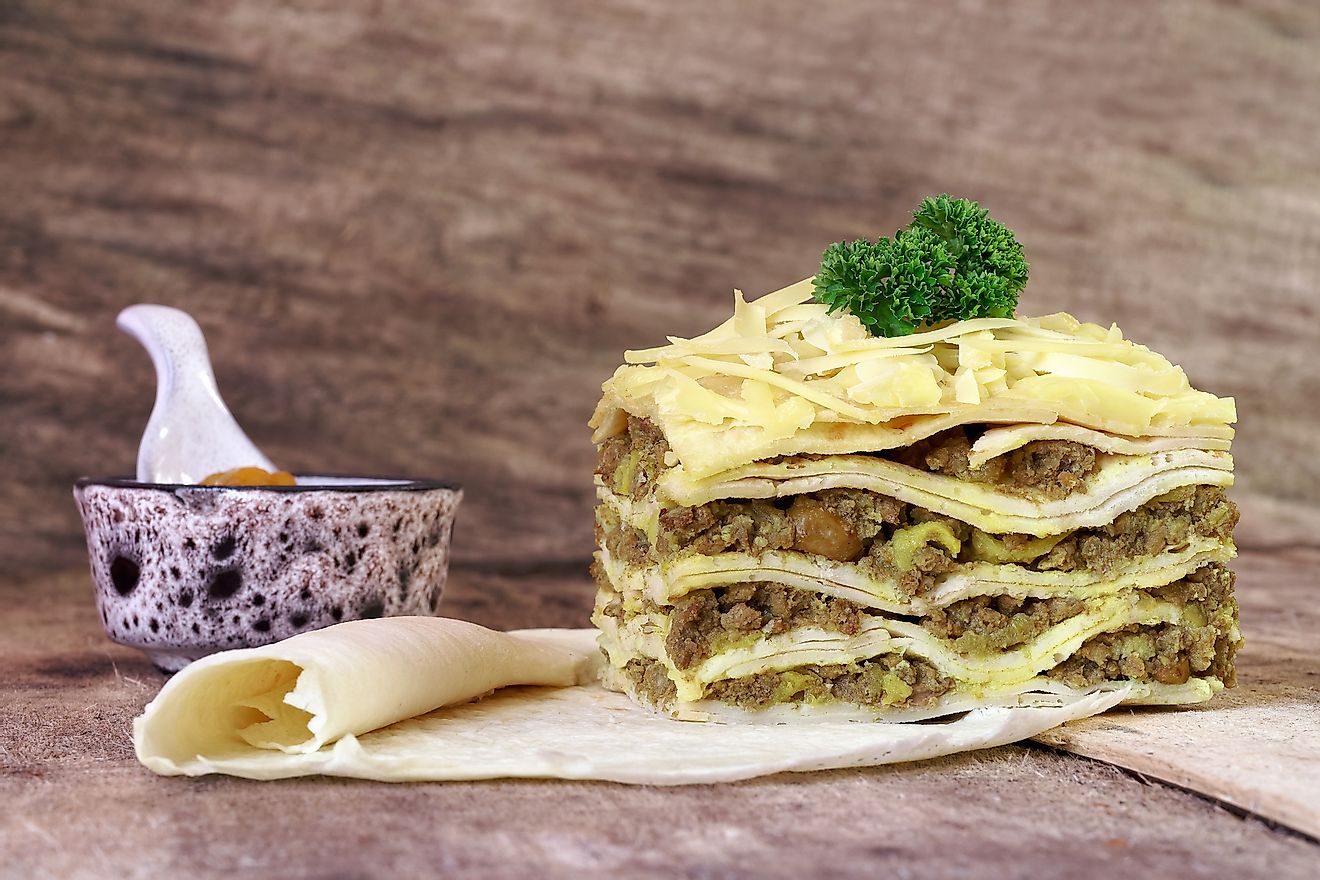 South African bobotie dish layered with pancakes. Image credit: MichelleCoppiens/Shutterstock.com