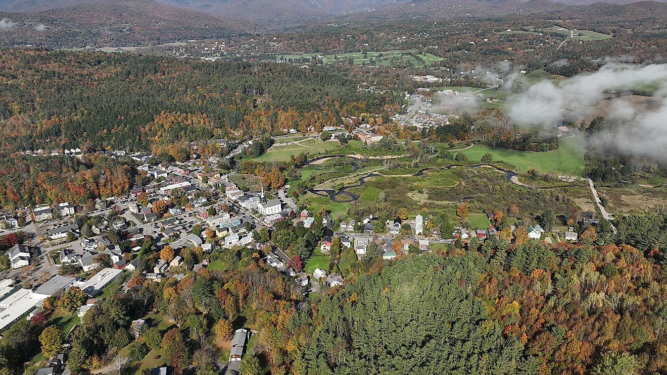 Aerial view of Shelburne, Vermont, surrounded by vibrant fall foliage.