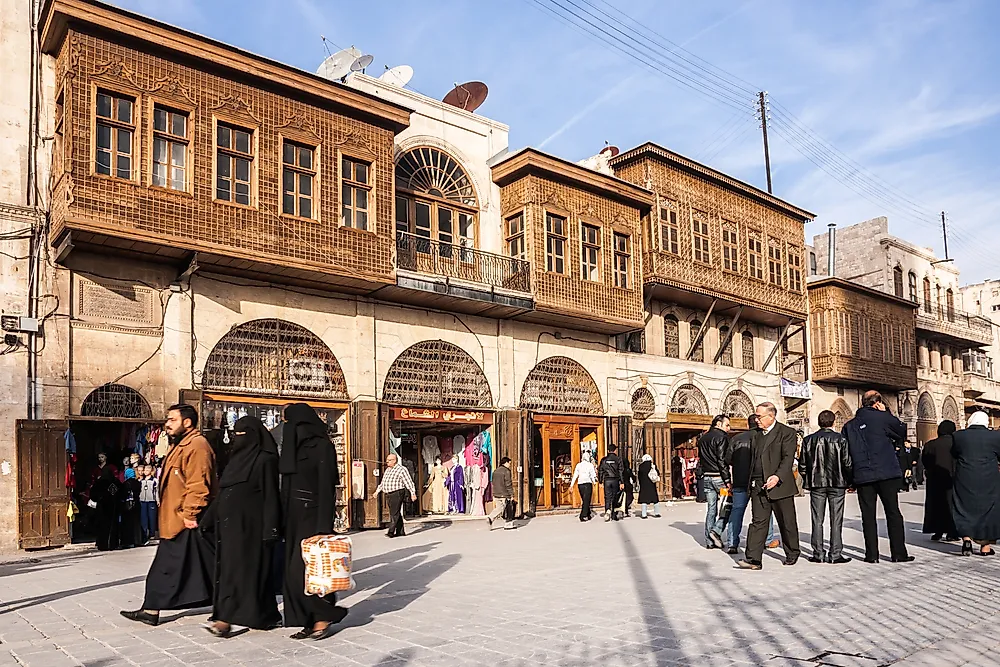 People walk in Aleppo, Syria in 2010. Editorial credit: Petr Louzensky / Shutterstock.com. 