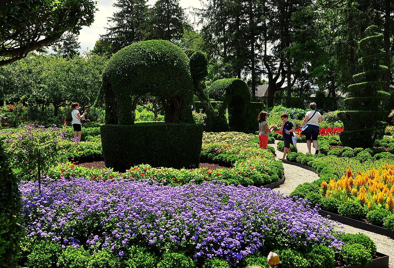 Visitors on the pathways amidst the spectacular Green Animals Topiary Gardens. Editorial credit: LEE SNIDER PHOTO IMAGES / Shutterstock.com