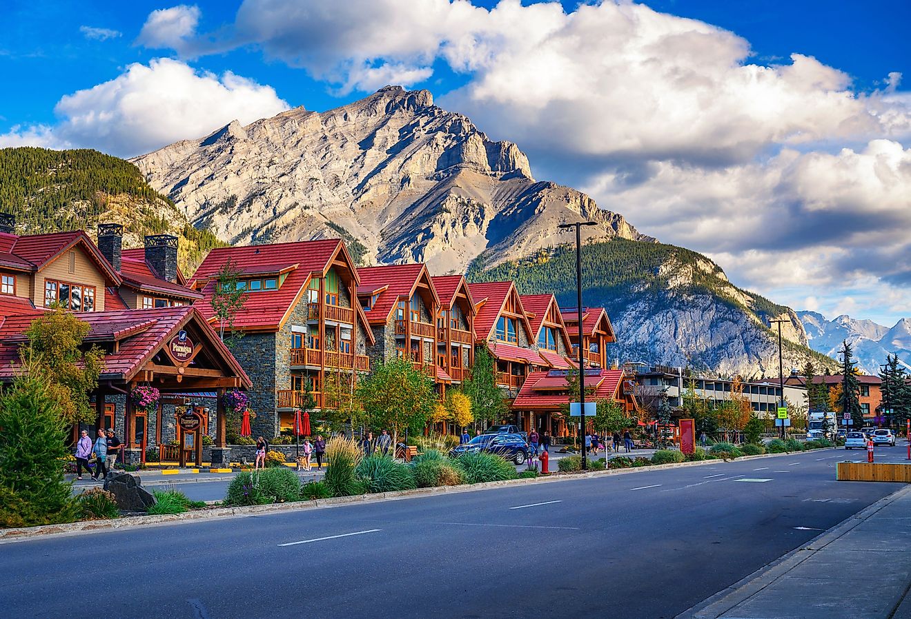 Scenic street view of Banff Avenue with cars and tourists, Banff, Alberta. Image credit Nick Fox via Shutterstock