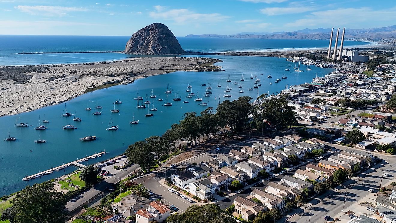 Aerial view of the town and massive rock formation along the coast in Morro Bay, California. Editorial credit: ByDroneVideos / Shutterstock.com