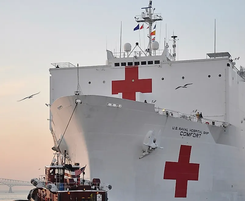 The USNS Comfort, a hospital and humanitarian aid ship displaying the Red Cross emblem upon its hull in Baltimore Harbor in the U.S. state of Maryland.