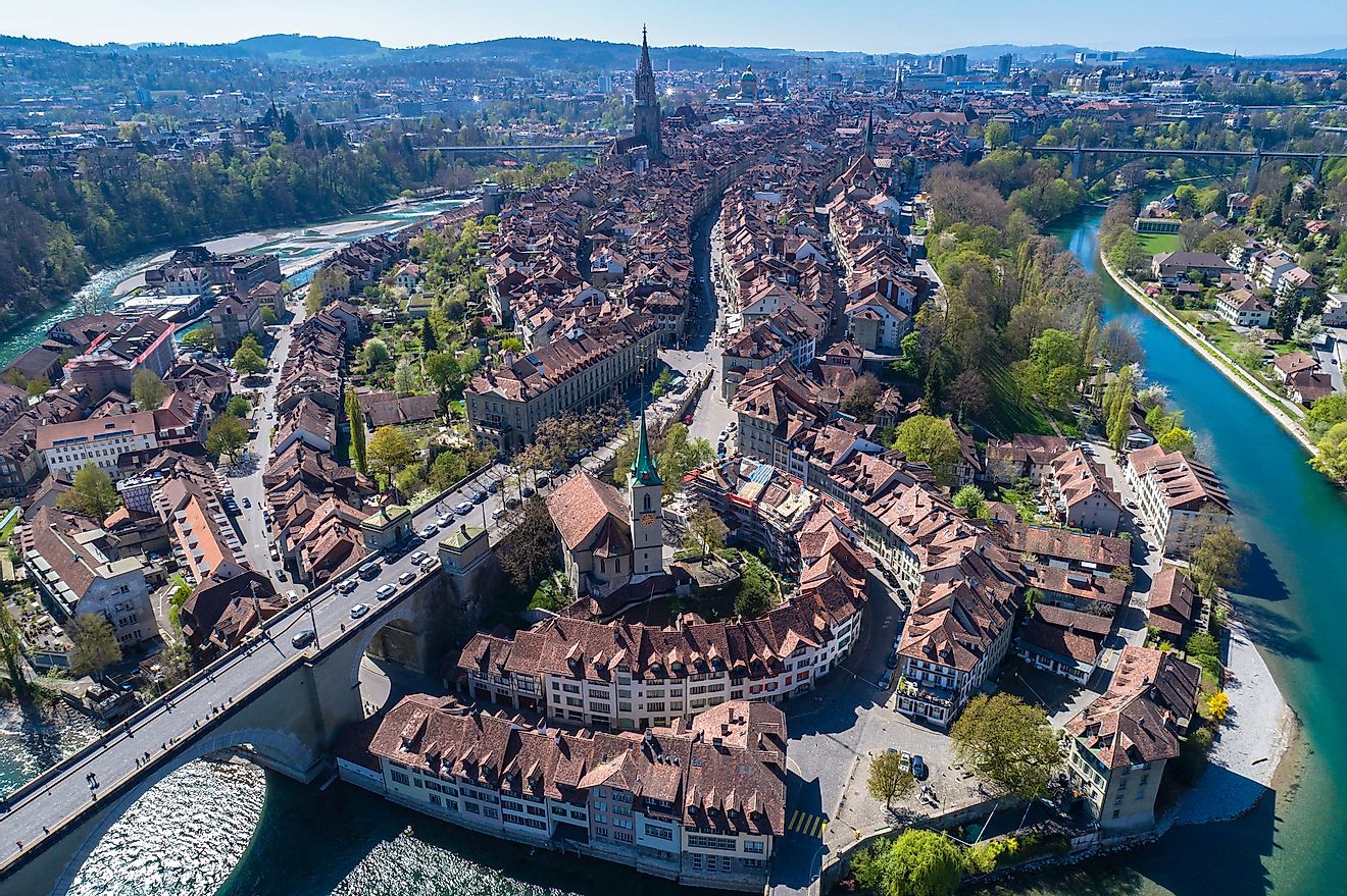 Aerial view of the Bern old town with the Aare river flowing around the town on a sunny day. Image credit: Peter Stein/Shutterstock.com