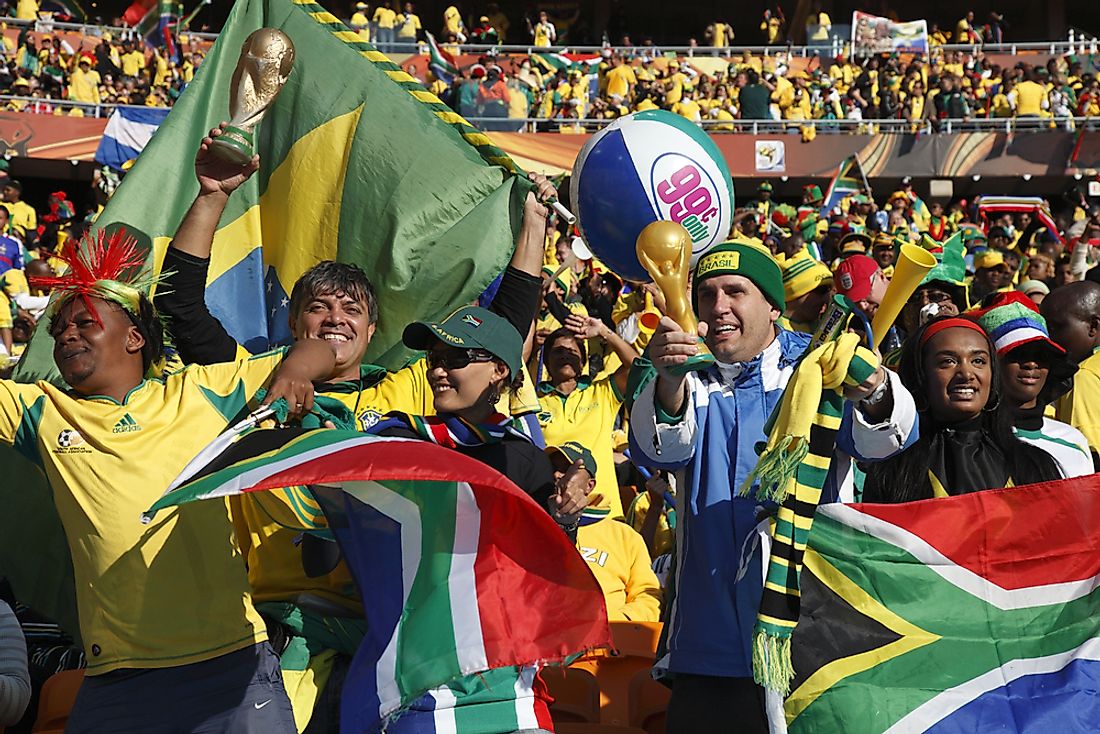 South Africans cheer at a World Cup game in Johannesburg. Editorial credit: fstockfoto / Shutterstock.com.