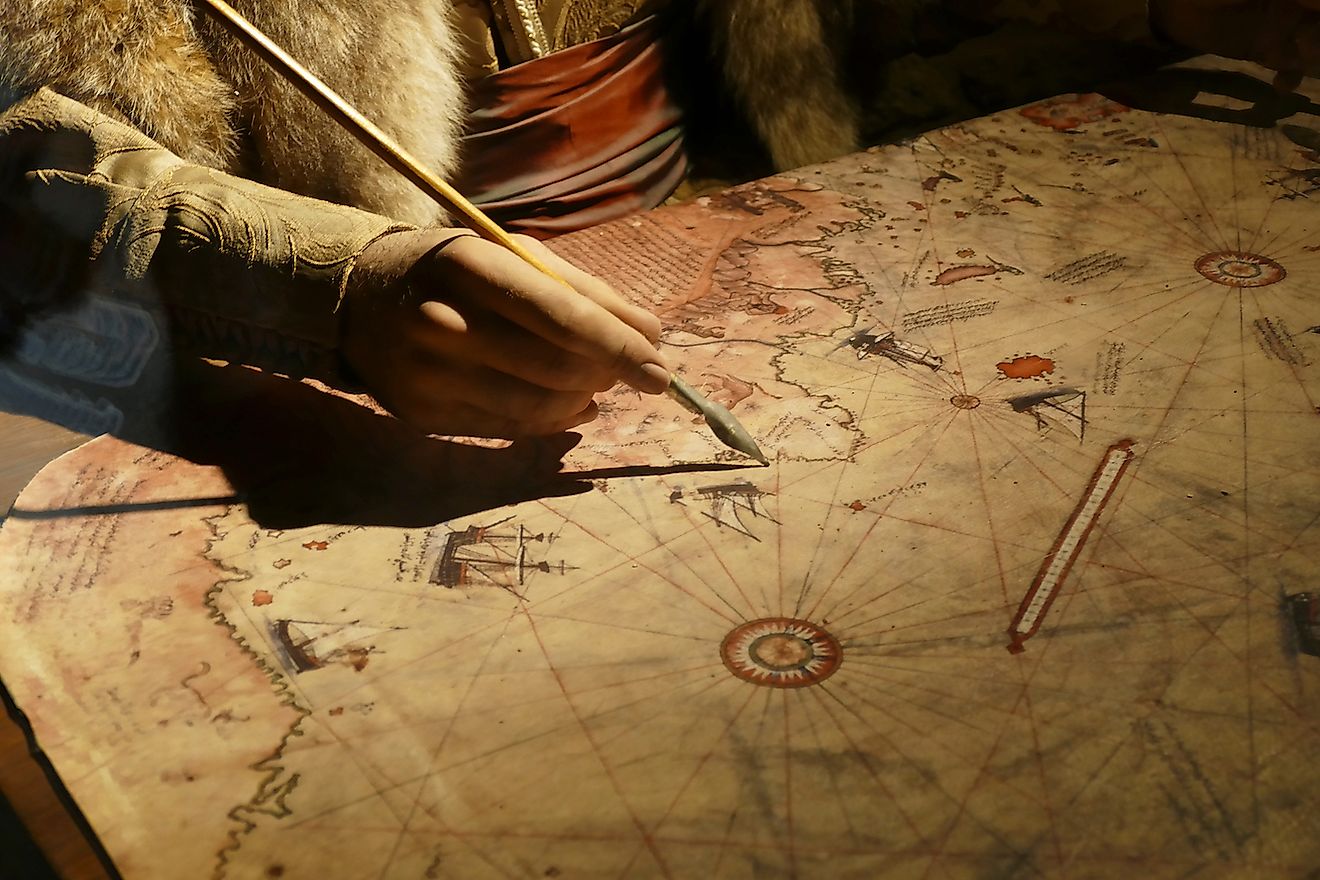 Cartographer drawing a map. Image credit: Steve Estvanik/Shutterstock.com