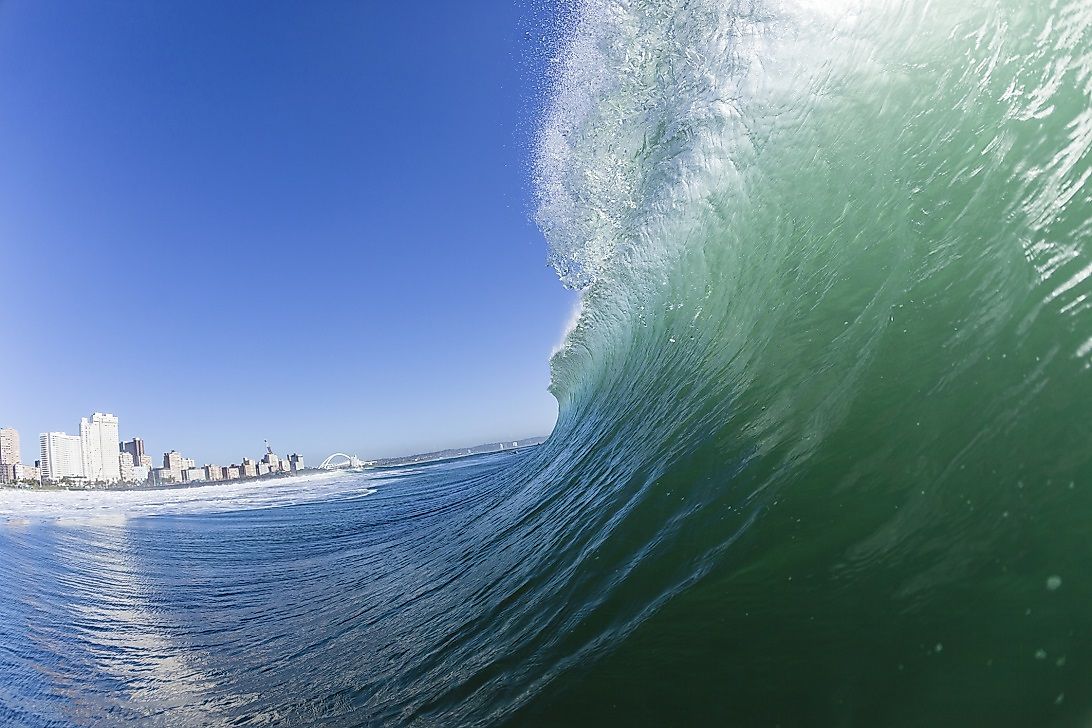 Waves crest and crash along the shore of the South African metropolis of Durban.
