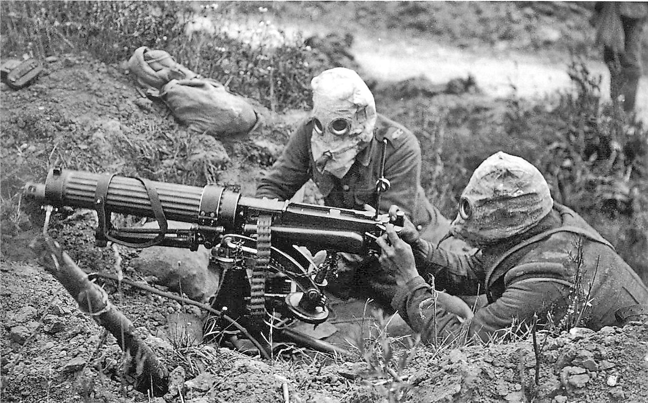 British Vickers machine gun crew wearing PH gas helmets with exhaust tubes. Image credit: John Warwick Brooke/ Public domain