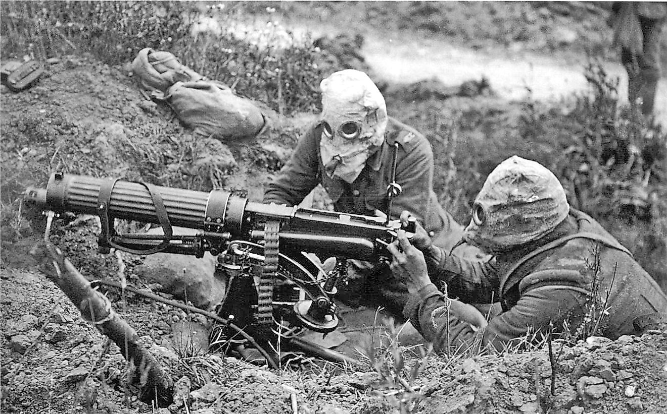 British Vickers machine gun crew wearing PH gas helmets with exhaust tubes. Image credit: John Warwick Brooke/ Public domain