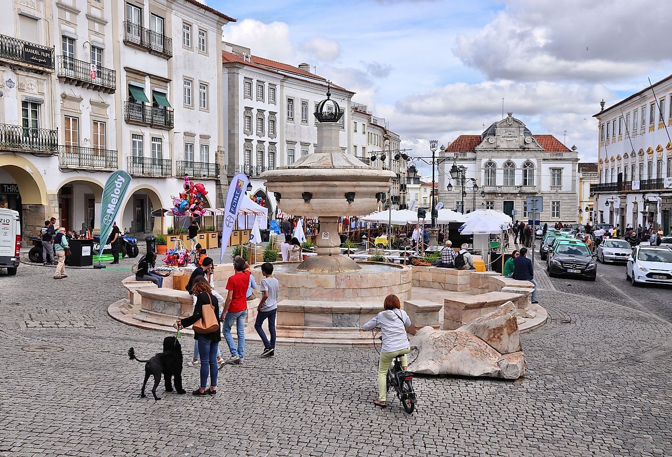 People visit Giraldo Square (Praca do Giraldo) in Evora, Portugal. Image credit Tupungato via Shutterstock