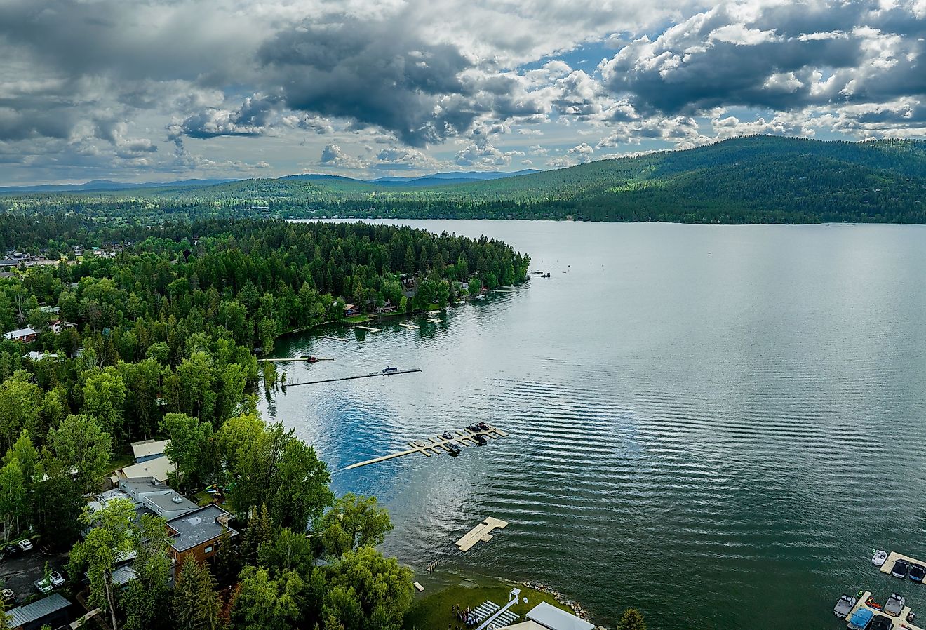 Aerial view of Whitefish Lake in Montana with docks and homes along the water's edge.