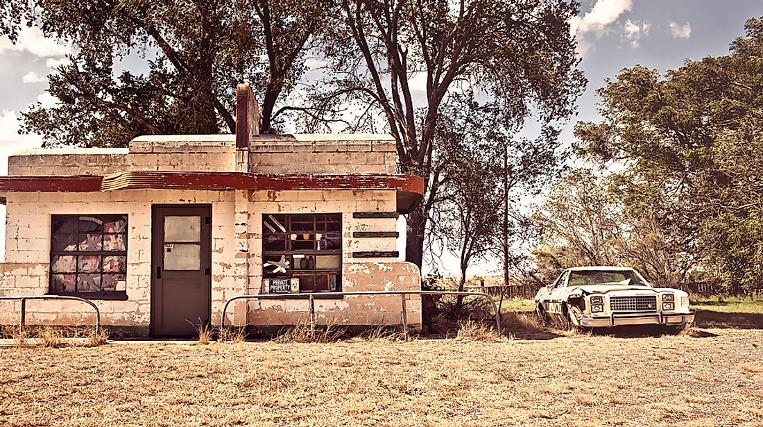 An abandoned building and car in the ghost town of Glenrio. Editorial credit: Andrey Bayda / Shutterstock.com