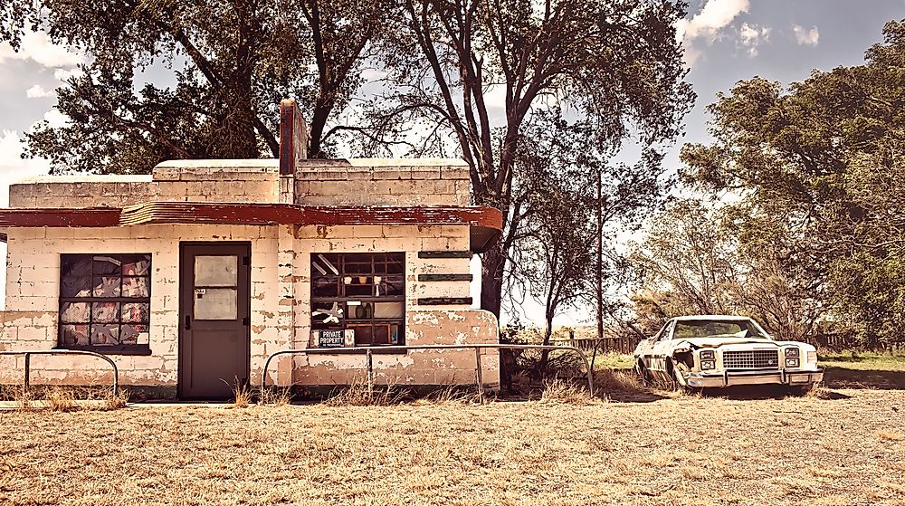 An abandoned building and car in the ghost town of Glenrio. Editorial credit: Andrey Bayda / Shutterstock.com