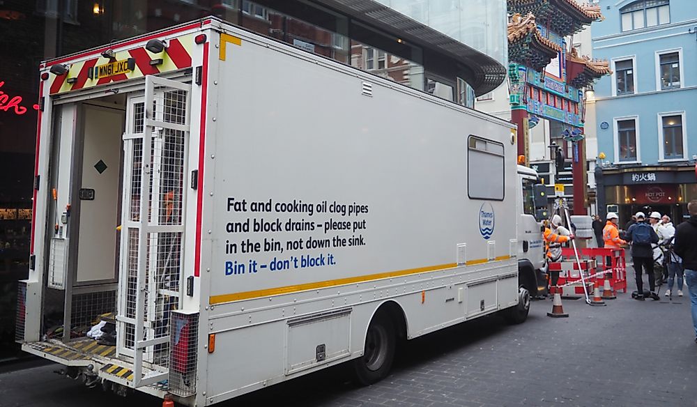 Workers prepare to remove a fatberg under the streets of London. Editorial credit: Brian Minkoff / Shutterstock.com