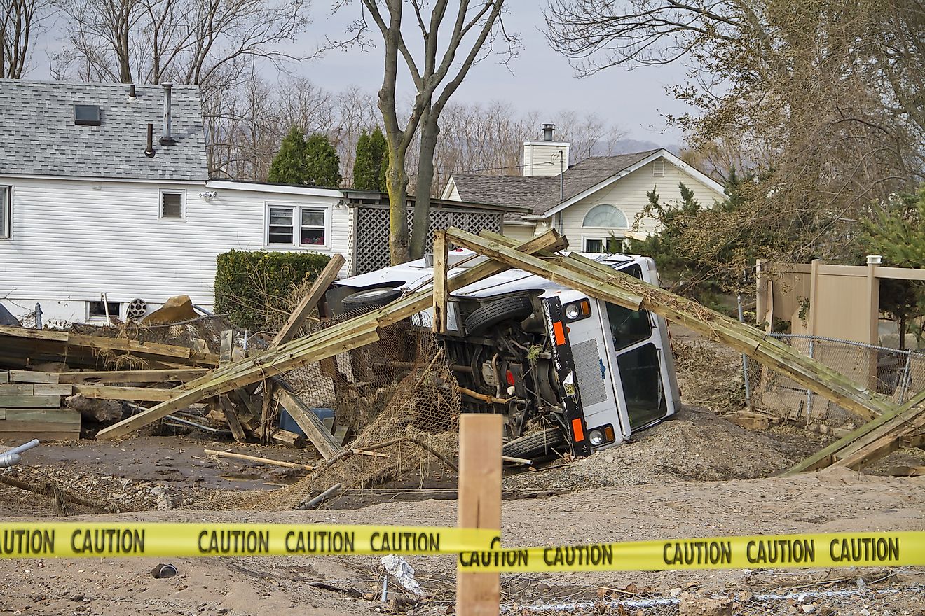 Over turned truck after Hurricane Sandy in the flooded neighborhood at South Beach Staten Island area on November 10, 2012 in New York City, NY. Image credit: shutterWhisper/Shutterstock.com