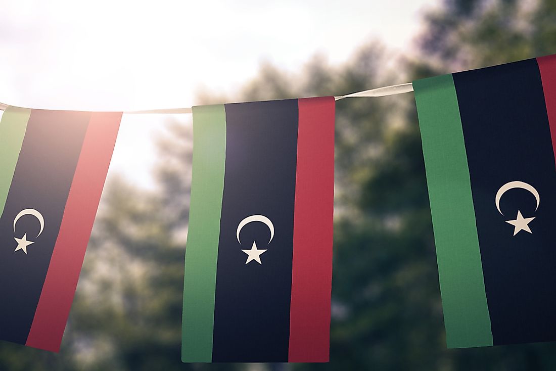 The flag of Libya on a banner. 